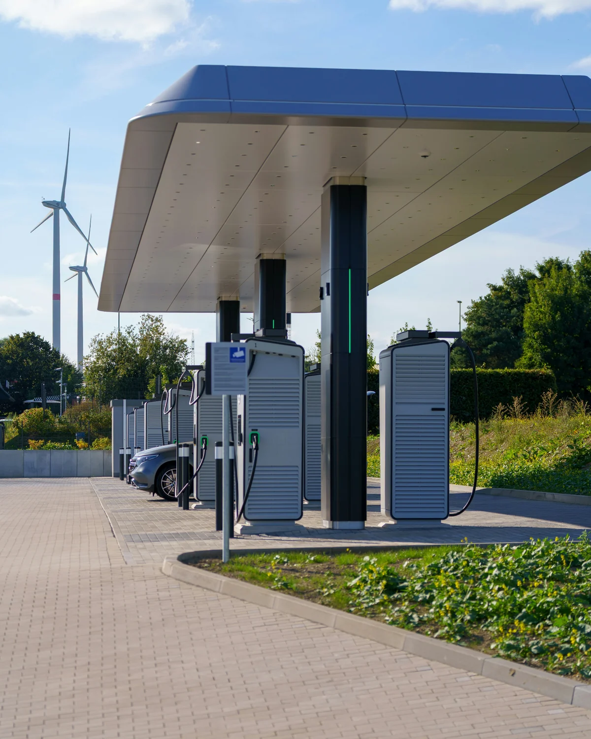 Modern EV charging hub with charging units under a canopy